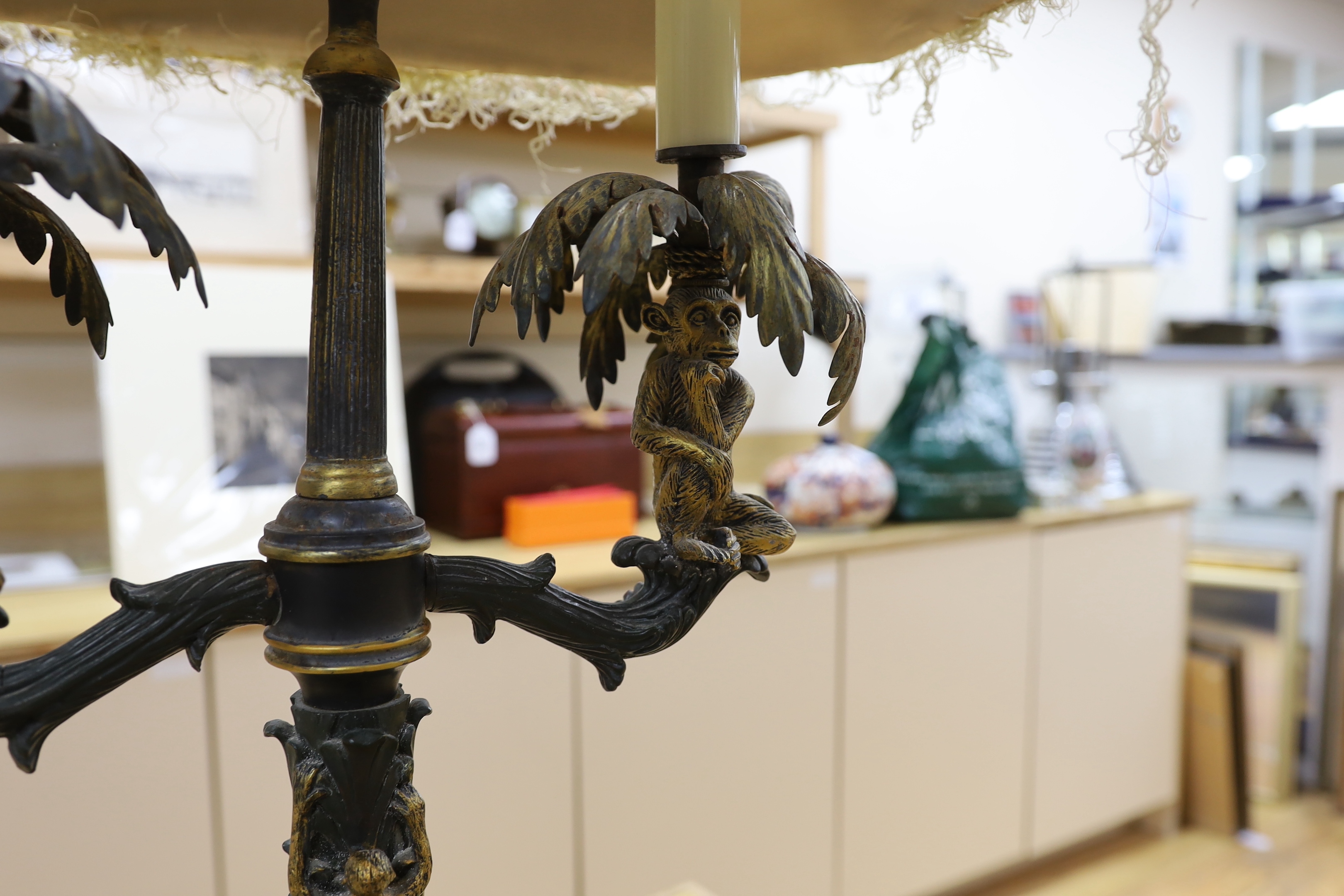 A pair of ornate brass sangerie lamps with shades, 78cm high